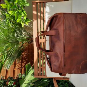 Handmade brown leather duffle bag with wheels made in Italy